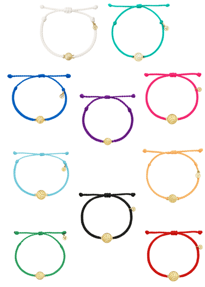 Collection of colorful volleyball bracelets with gold beads on a white background